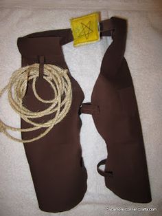 a pair of boots with rope attached to them sitting on a white towel next to a yellow tag