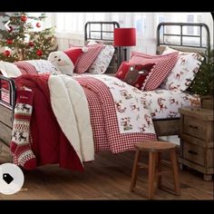 a bedroom decorated for christmas with red and white bedding