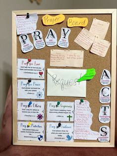 a bulletin board with some writing and magnets attached to the cork notice board is shown