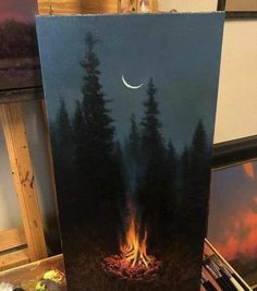 a painting of a campfire with the moon in the sky and trees on it