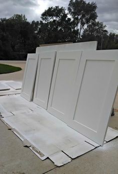 three white doors sitting on top of each other