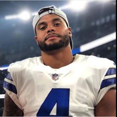 a close up of a person wearing a football uniform