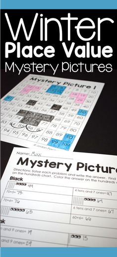 the mystery pictures game for winter place value is shown on top of a black table