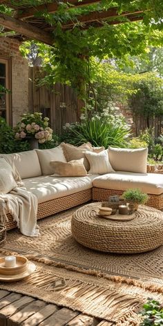 an outdoor living room with wicker furniture