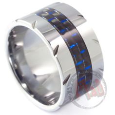 a wedding ring with blue and black carbon fiber inlays on the inside of it