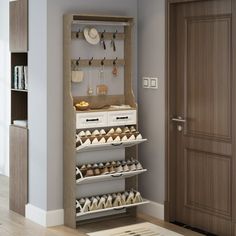 an open cabinet with shoes and other items on it next to a door in a room