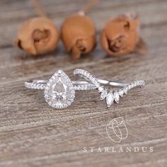 a close up of a diamond ring on a wooden table