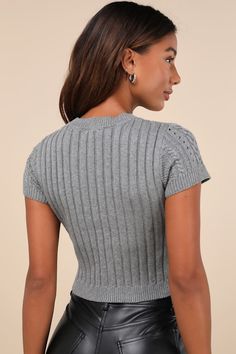 Your autumn style will be truly special with a trendy must-have like the Lulus Modish Ways Heather Grey Cable Knit Short Sleeve Sweater Top! This soft and stretchy sweater (with a subtle heathered effect throughout) boasts a variety of classic designs, including cable, seed, and ribbed knit textures (plus pierced detailing), that makes this piece truly unique. A timeless crew neckline and a fitted, cropped bodice are framed by cute short sleeves, while contrasting ribbed knit trim at the necklin Trendy Gray Knit Top With Crew Neck, Trendy Gray Crew Neck Knit Top, Trendy Gray Stretch Knit Top, Trendy Stretch Gray Knit Top, Cozy Ribbed Fitted Knit Top, Fitted Crew Neck Knit Top In Gray, Cozy Fitted Ribbed Knit Top, Fitted Crew Neck Gray Knit Top, Fitted Gray Crew Neck Knit Top