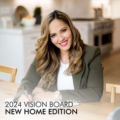 a woman sitting at a table with a pen and paper in front of her, which reads, 2012 vision board new home edition