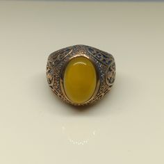 This empower ring is an awesome design bronze ring with an oval yellow Aqeeq. It is an awesome Masonic icon design bronze ring with a cabochon Yellow Aqeeq. It is an awesome design bronze ring. It has designed and made in Thailand. It is for the people who love to collect rare limited edition items and who wants to be different. This ring is one of a kind item for you. Material: Bronze The Main Stone: Yellow Aqeeq (Yellow Agate) Stone Color: Yellow Stone size: 10 x 14 mm. Ring weight approx.: 8 Bronze Oval Rings As Gifts, Bronze Oval Rings For Gift, Oval Bronze Rings For Gift, Yellow Agate, Bronze Ring, Yellow Stone, Ring For Men, Antique Design, Natural Blue Sapphire