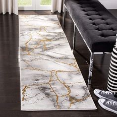 a white and gold rug in a living room