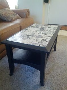 a coffee table sitting on top of a carpeted floor next to a brown couch