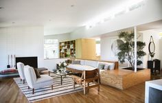 a living room filled with furniture and a fire place