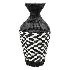 a black and white vase sitting on top of a table