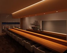 an empty bar with white chairs and wooden counter