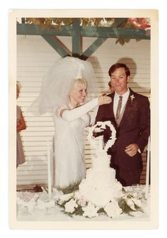 an old photo of a bride and groom cutting their wedding cake at the end of the day