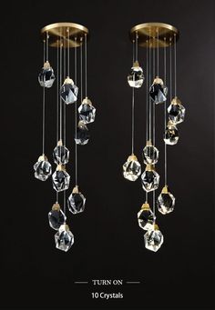 two chandeliers with crystal balls hanging from them