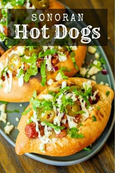 two hot dogs with toppings on a plate and the title says, sonoran hot dogs