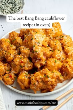 the best bang bang cauliflower recipe in oven on a plate with chopsticks