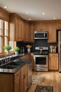 a kitchen with wooden cabinets and black counter tops, stainless steel appliances and wood flooring