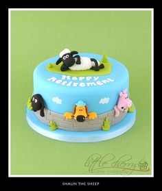 a blue cake with sheep and sheep on it