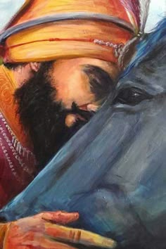 a man in a turban is looking at something