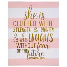 a pink and white striped card with gold foil lettering that says she is clothed with strength and