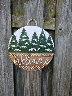 Embrace the serene beauty of the season with our Round Door Sign featuring elegant winter trees and the word "Welcome." This charming design brings the peaceful essence of winter to your entryway, perfect for greeting guests all season long! While our signs are great additions to your own home, they also make great gifts! Think housewarming gift, birthday gift for loved ones, wedding gift, Christmas gift, or just because! Available in a variety of themes, you're sure to find a design perfect for Winter Door Signs, Wood Door Signs, Loved Ones Wedding, Round Door Sign, Christmas Wood Signs, Sports Mom Gifts, Sports Lover Gifts, Personalized Pencil Case, Vinyl Doors