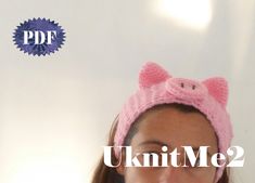 a woman wearing a pink knitted pig hat with the words uk int me 2 below it