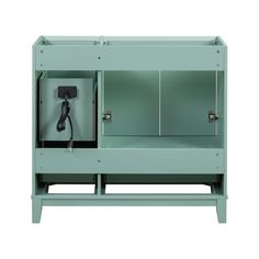 a green cabinet with an electric plugged in it's side panel and the door open