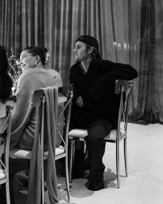 black and white photograph of two people sitting at a table