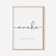 the word anaka written in cursive handwriting on a white background with a wooden frame