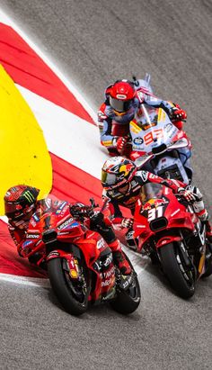 two motorcyclists racing on a race track