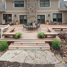 a patio with steps leading up to the house