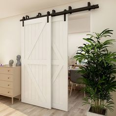 an open sliding door in a room with a potted plant next to it and a dresser