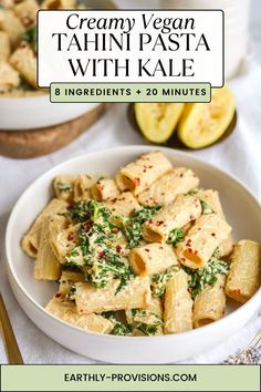 creamy vegan pasta with kale in a white bowl