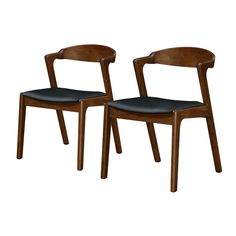 two wooden chairs with black leather seats on each side, one is facing away from the other