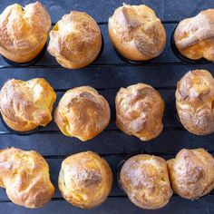 freshly baked muffins are lined up on a cooling rack, ready to be eaten