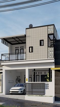 a white car parked in front of a two story house with a balcony and balconies