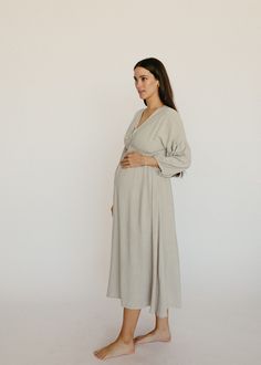 Pregnancy, postpartum and nursing - this dress does it all! This linen midi dress is light and flowy, it pairs beautifully with a bump and is nursing friendly. The soft grey color, front tie detail and peasant sleeve are understated feminine details. You'll feel like you're the star of your own Nancy Meyers movie in th Maternity Night Dress, Peasant Sleeve Dress, Maternity Dresses Modest, Nursing Friendly Dress For Wedding, Winter Baby Shower Dress For Mom, Maternity Wedding Guest Outfit, Maturity Clothes, Pregnant Wedding Guest Outfits, Cute Pregnancy Outfits