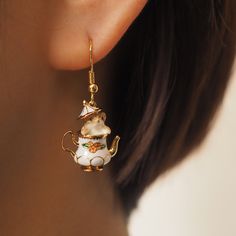 Earrings and necklaces with cute squirrels peeking out from a ceramic tea pot decorated with flower patterns. A fantastical world that looks like something out of a fairy tale. The lid of the tea bottle rests on the squirrel's head, resembling her hat. I wonder if the inside of the tea jar is the squirrel's secret home. 
 
 
 Item 
 
 Earrings 
 Earrings 
 Necklace 
 
 
 Size 
 
 Length: 3.7cm 
 Width: 0.5cm 
 
 
 Material 
 
 Silver529 
 Alloy 
 
 
 Others 
 
 Please refrain from ordering if yo Teapot Earrings, Teapot Necklace, Paper Rings, Earring Gift, Funky Jewelry, Drop Earring, Enamel Jewelry, Dream Jewelry, Chipmunks