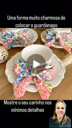 a table with plates, cups and saucers decorated with flowers on the top one plate has a bow tie around it