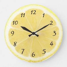 a clock made to look like a slice of lemon on a white background with black numbers