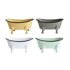 four different colored bath tubs sitting next to each other on a white surface with black trim