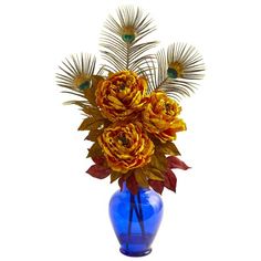 a blue vase filled with yellow and red flowers