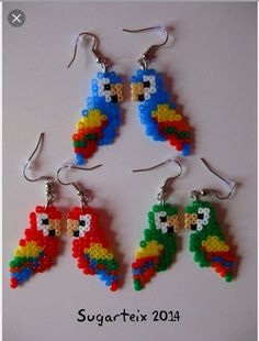 four pairs of beaded earrings with parrots on them