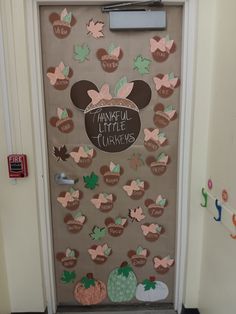 a door decorated with many different types of leaves and words that read, thanksgiving little turkeys