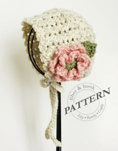 there is a crocheted hat with flowers on it