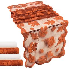 four pieces of orange and white fabric with leaves on them