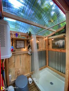 the inside of a small bathroom with a shower and tub in it's corner